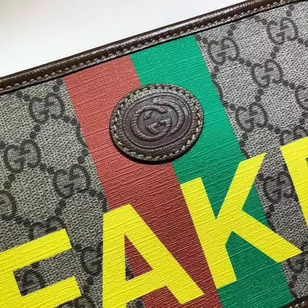 【原版皮】古驰/Gucci 印花手拿包,经典GG Supreme高级人造帆布匠心制成,点缀Fake和Not词语印花,在品牌标志性元素中注入诙谐意味,款号:636243